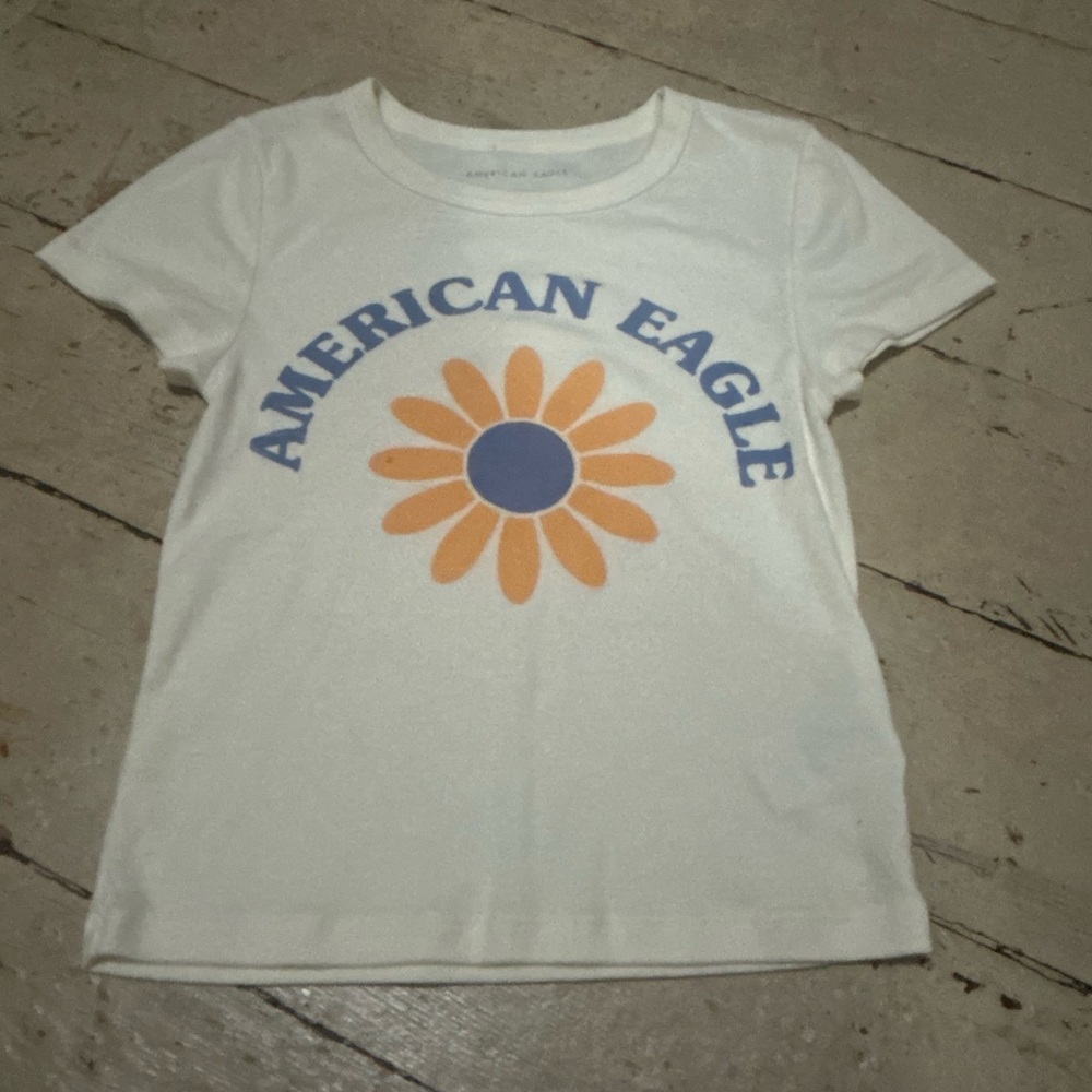 American Eagle Outfitters Cream Tee with Orange and Blue Graphic